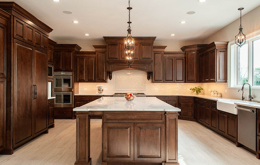 Timeless design featuring beautifully stained cabinets and classic white tile and countertops.