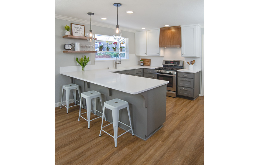 A fresh look and opened up layout shine in this refaced kitchen. 