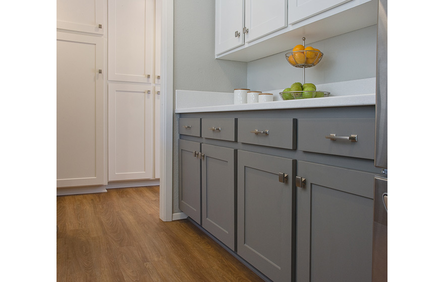 A fresh look and opened up layout shine in this refaced kitchen. 