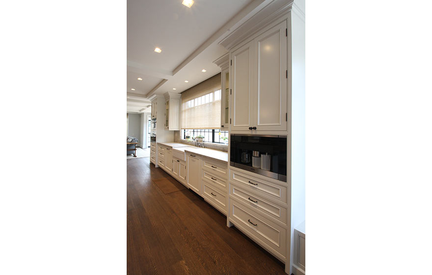 Impressively clean design are softened up with a custom applied molding door.