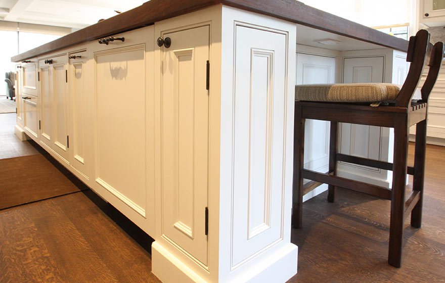 Impressively clean design are softened up with a custom applied molding door.