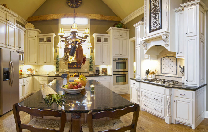 Tall cabinetry in a stunning arched ceiling kitchen creates a dramatic space.