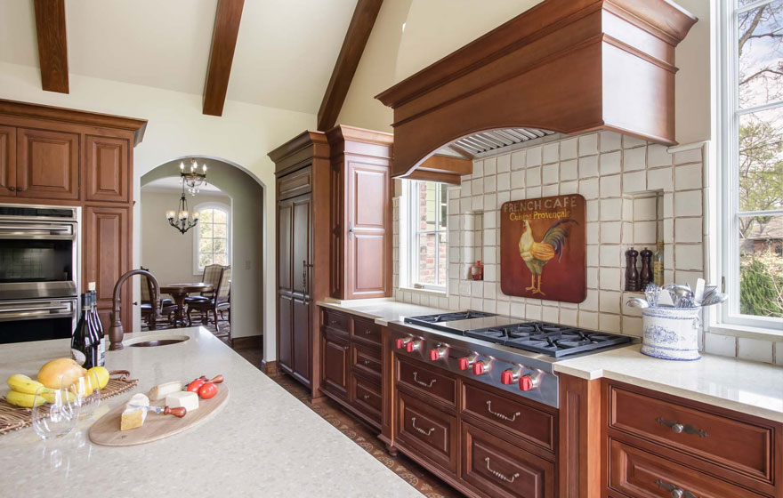 A customized door style is featured in this beautiful, bright kitchen.