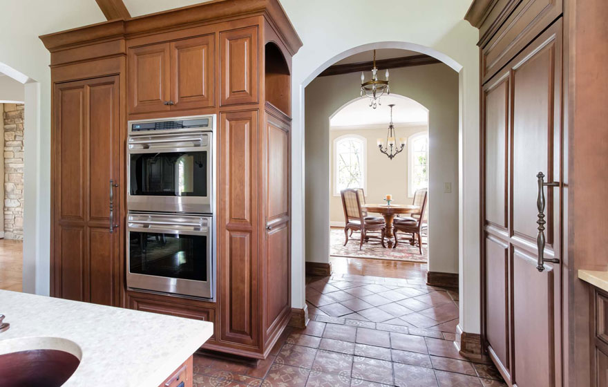 A customized door style is featured in this beautiful, bright kitchen.