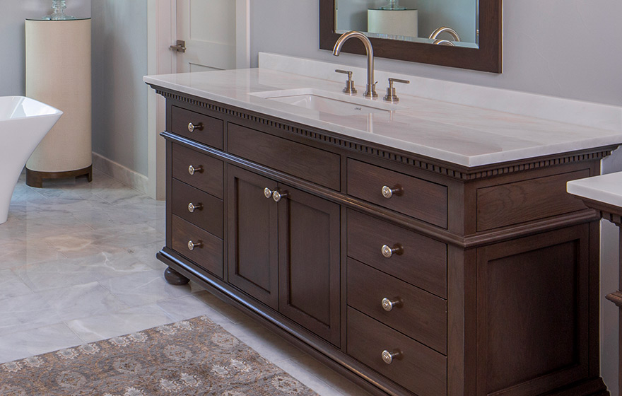 The light color pallete allows the woodgrain to draw attention in this elegant bathroom. 