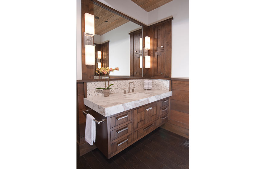 A tranquil space tucked into this mountain retreat brings in the natural warmth of the wooded surroundings with Alder cabinet doors.