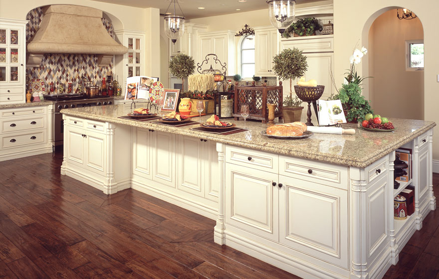 Dramatic size and stature make this lavish kitchen awe-inspiring while built-in eating areas and smart layout design help retain its everyday practicality for making a house a home.