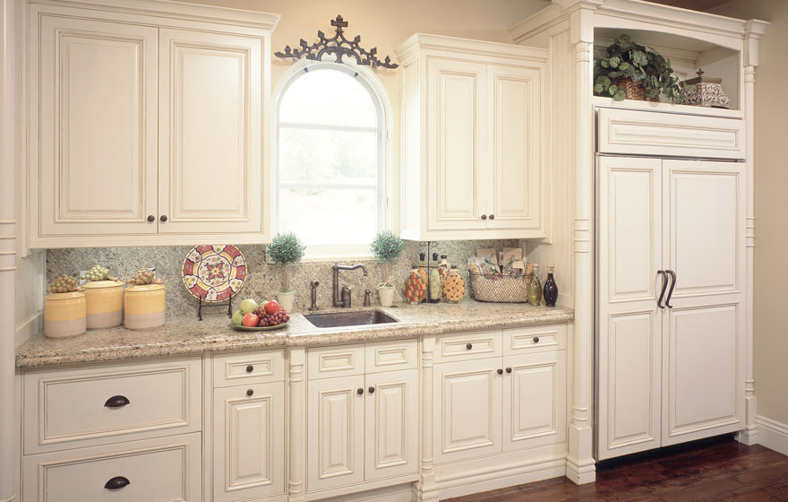 Dramatic size and stature make this lavish kitchen awe-inspiring while built-in eating areas and smart layout design help retain its everyday practicality for making a house a home.