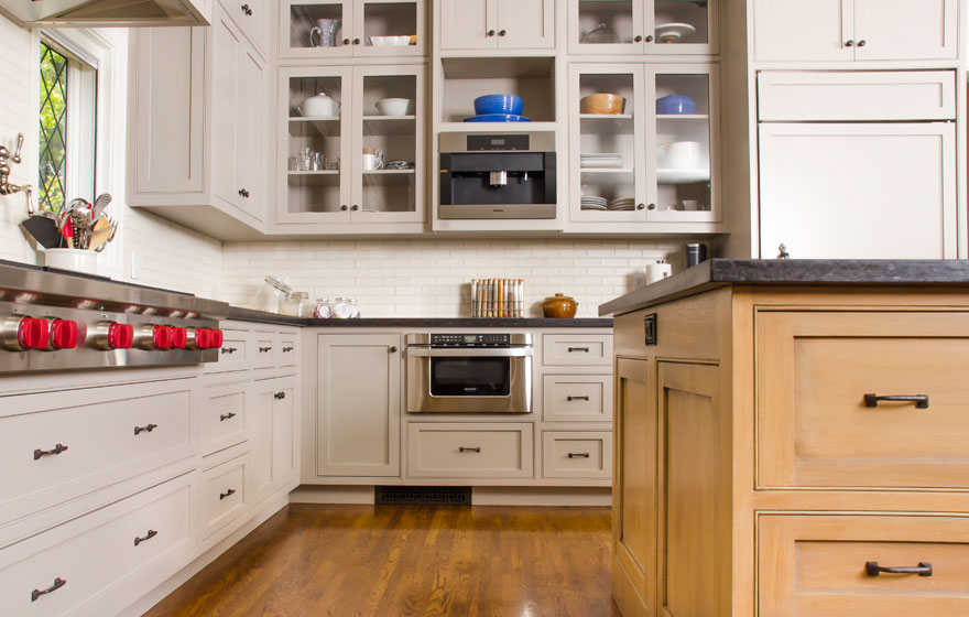 Rift Sawn White Oak pairs with painted cabinetry for a chic look in this large kitchen featuring dual islands.