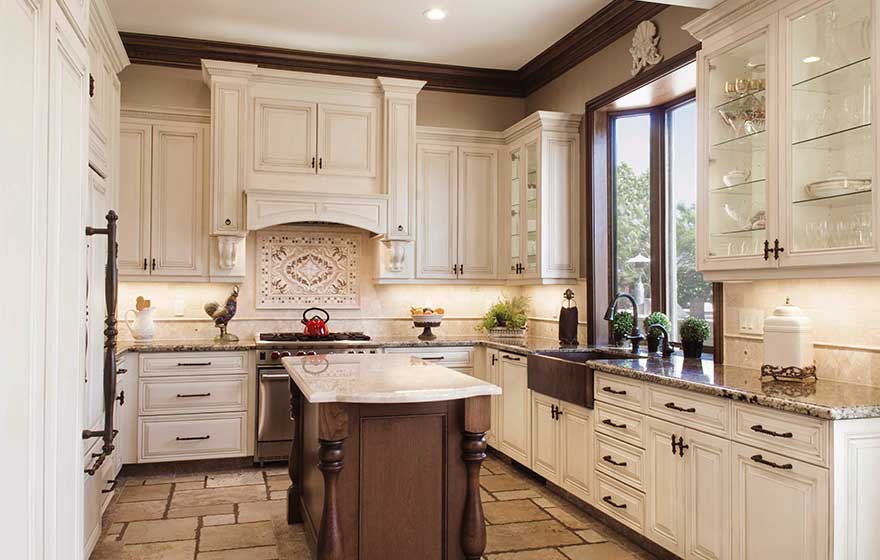 This elegant kitchen with glaze detail paint is the perfect place to enjoy your morning cup of coffee.