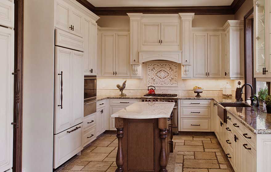 This elegant kitchen with glaze detail paint is the perfect place to enjoy your morning cup of coffee.