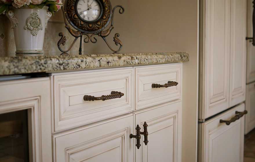 This elegant kitchen with glaze detail paint is the perfect place to enjoy your morning cup of coffee.