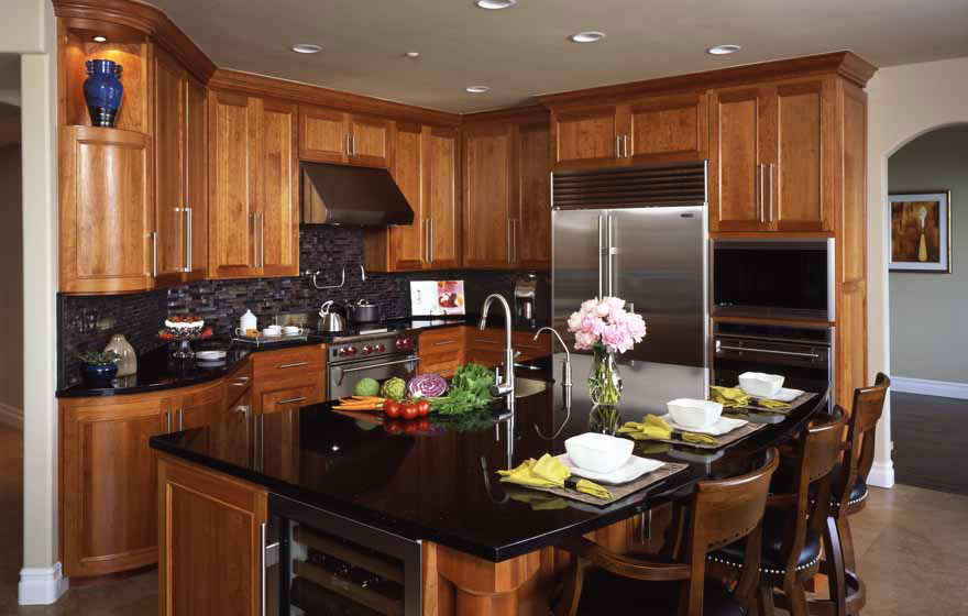 Let the beauty of cherry shine through by using a clear or light stain and using dark tile and granite to make the cabinetry the focal point.