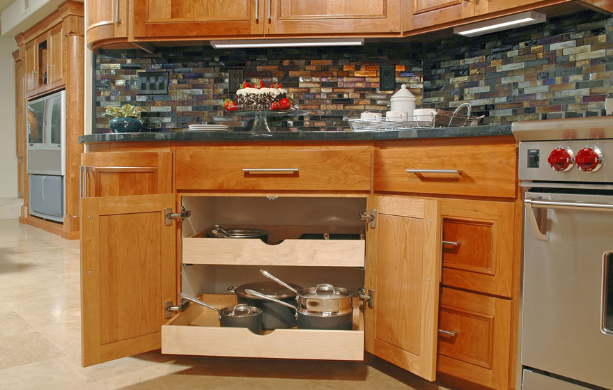 Let the beauty of cherry shine through by using a clear or light stain and using dark tile and granite to make the cabinetry the focal point.