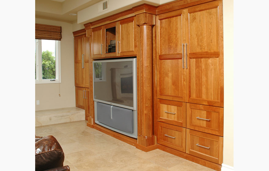 Let the beauty of cherry shine through by using a clear or light stain and using dark tile and granite to make the cabinetry the focal point.