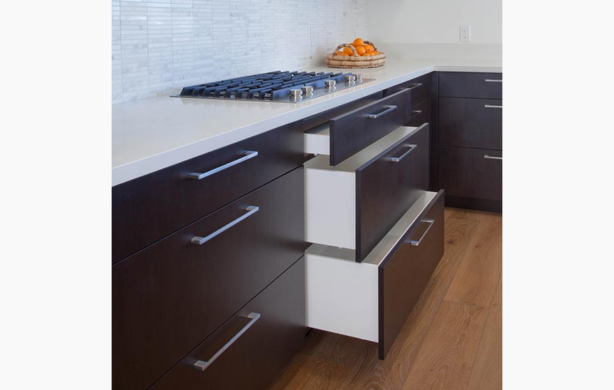 A sultry deep stain on Walnut veneer is paired with Streamline® RTA Cabinets result in a picture perfect place to call home.