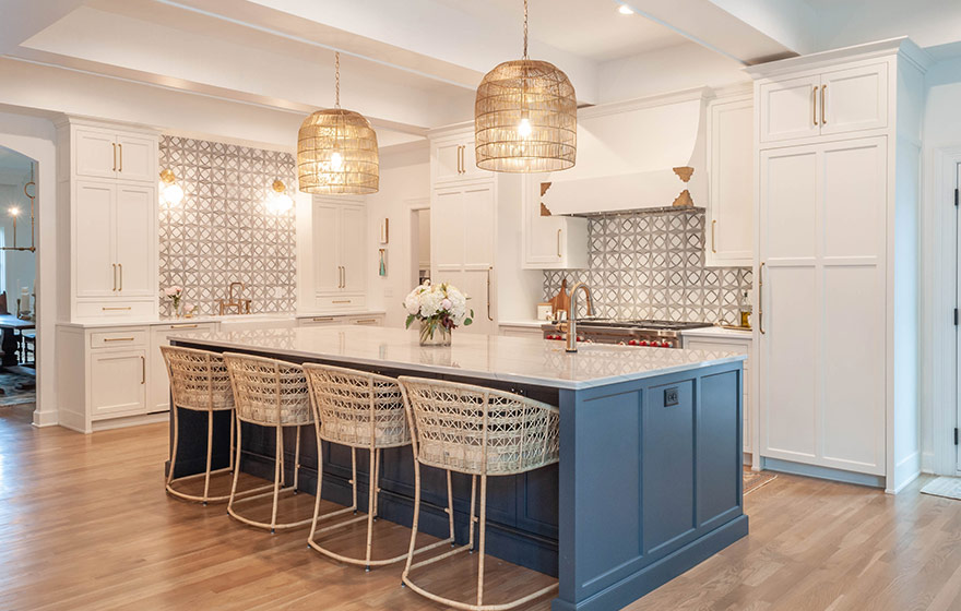 Beautiful blue paint add just the right amount of color to this stunning white kitchen