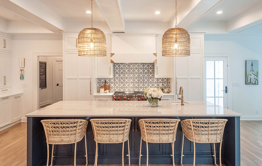 Beautiful blue paint add just the right amount of color to this stunning white kitchen