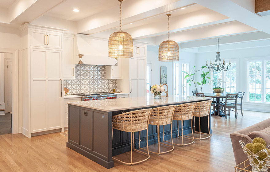 Beautiful blue paint add just the right amount of color to this stunning white kitchen