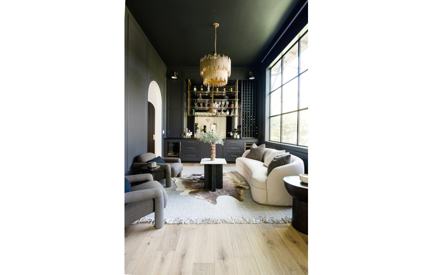 Dark paint adds drama and elegance to this inviting lounge area